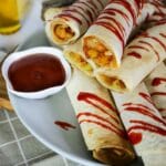 cropped-vegan-taquitos-drizzled-with-sriracha-sauce.jpg
